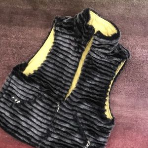 Reversible faux fur vest.